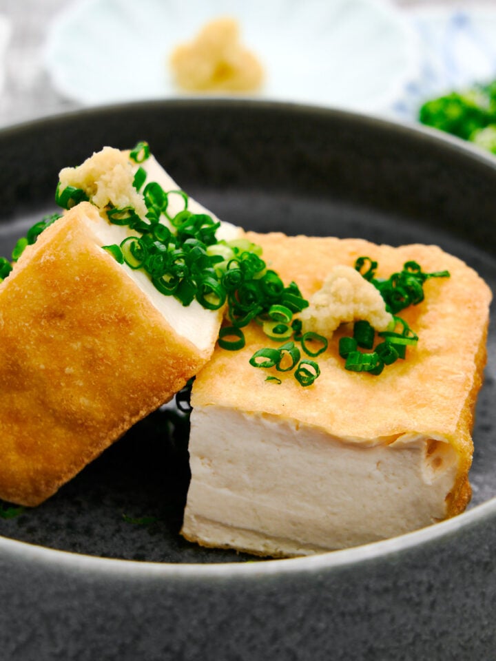 Crispy Atsuaage tofu topped with scallions and ginger makes for a delicious Japanese appetizer.