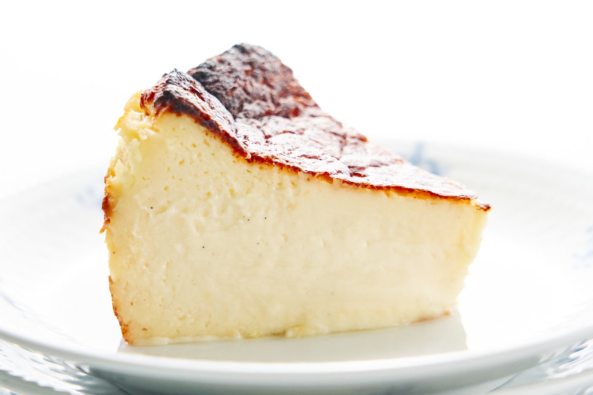 By baking the Basque Cheesecake in a scorching hot oven, the top gets a little burnt while the center remains silky smooth.