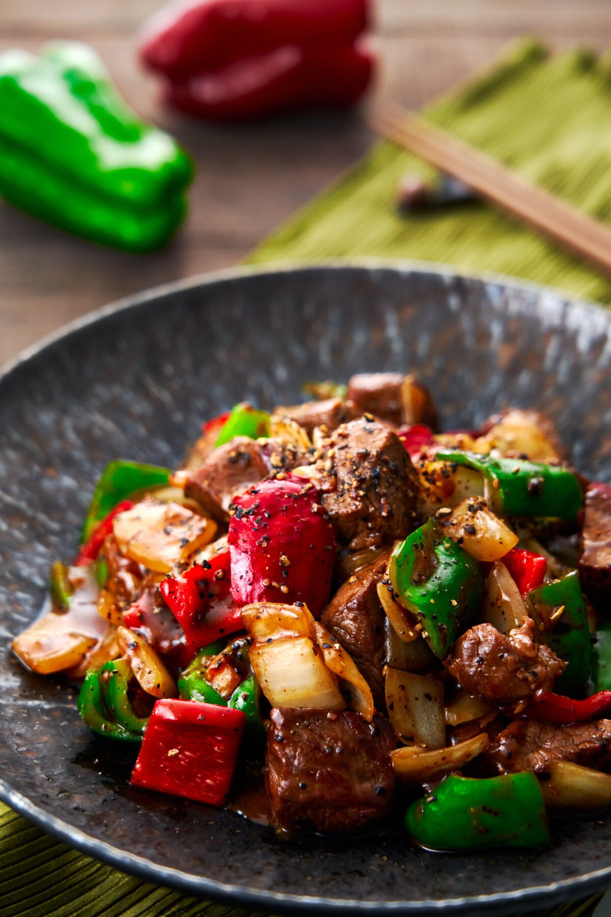 This Beef with Chinese Black Pepper Sauce recipe is an easy stir-fry with big juicy chunks of steak, onions, and peppers glazed in fragrant pepper sauce.