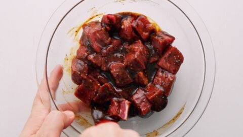Marinating beef tenderloin in Chinese black pepper sauce.