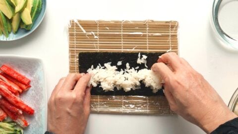 Spread an even layer of rice onto the nori.