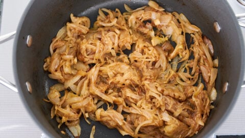 Caramelized onions add a pleasant sweetness to contrast the spicy chicken in the Biryani.