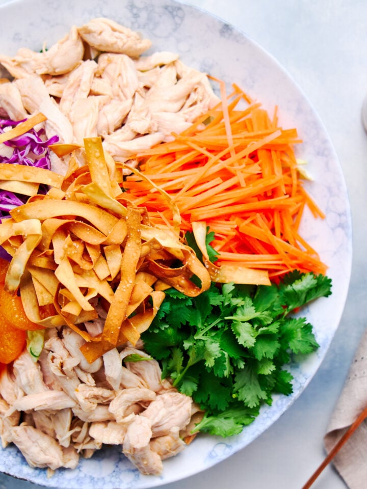 With a rainbow of toppings and a zesty ginger dressing, this Chinese Chicken salad is a treat for all of your senses.