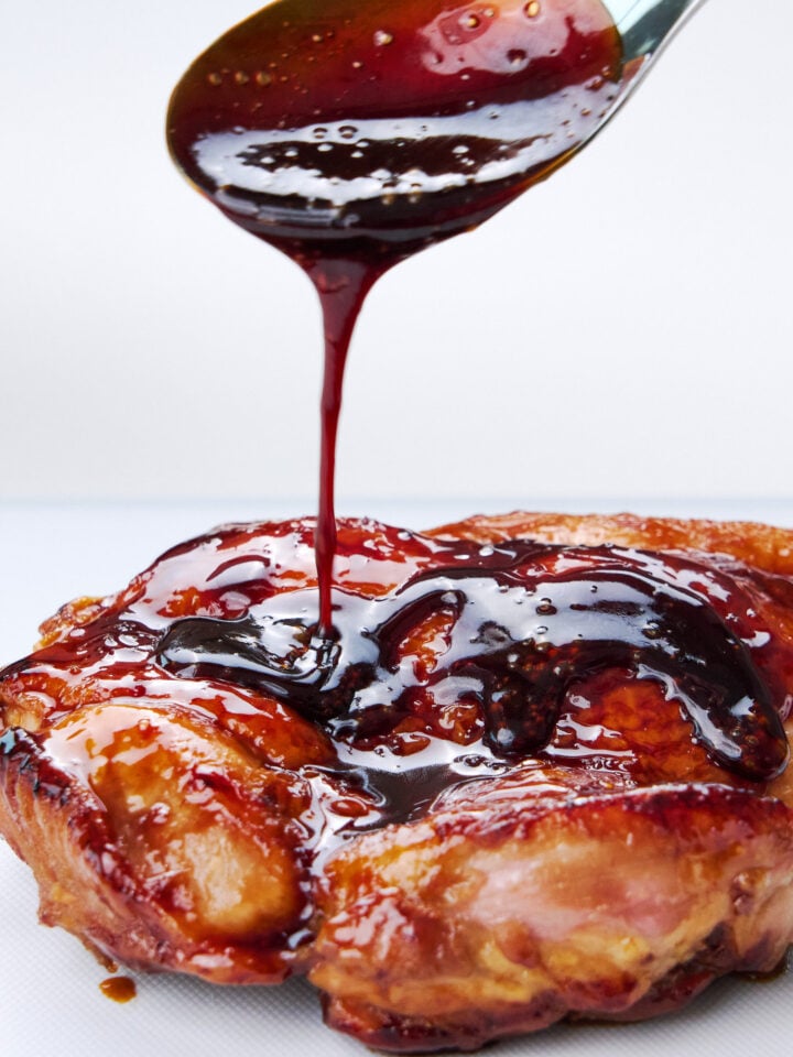 Drizzling authentic Japanese teriyaki sauce over chicken.