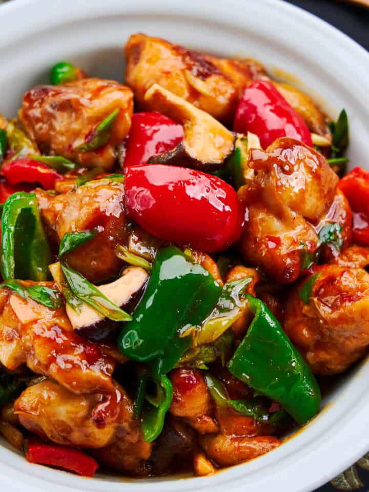 Hunan chicken is an easy weeknight stir fry featuring juicy hunks of marinated chicken and a vibrant medley of peppers in a spicy sauce with a bright tang.