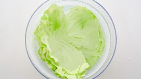 Soaking the cabbage leaves in cold water to crisp them up.