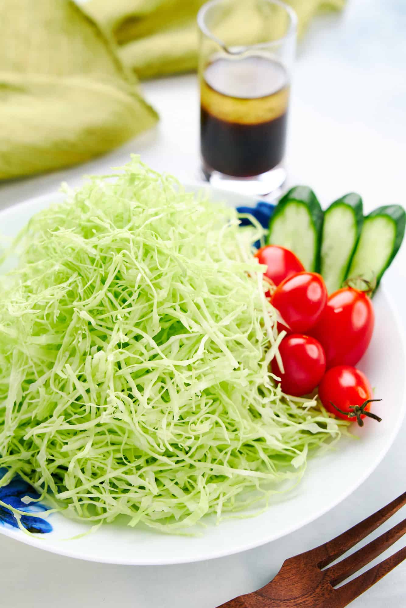 Japanese shredded cabbage salad is served as a side dish for many Japanese fried dishes such as tonkatsu, ebifry, and korokke.