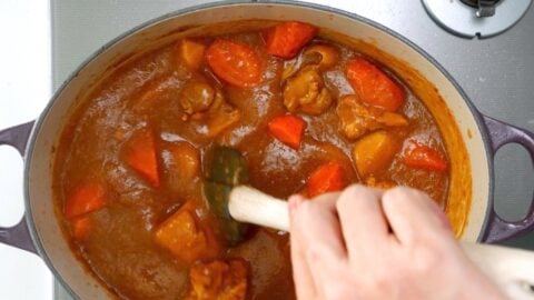 As the curry cooks down it takes on a darker color.