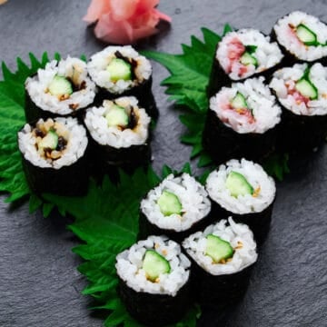 Detailed cross-section view of three variations of cucumber sushi roll or Kappa Maki, highlighting the balance of ingredients.