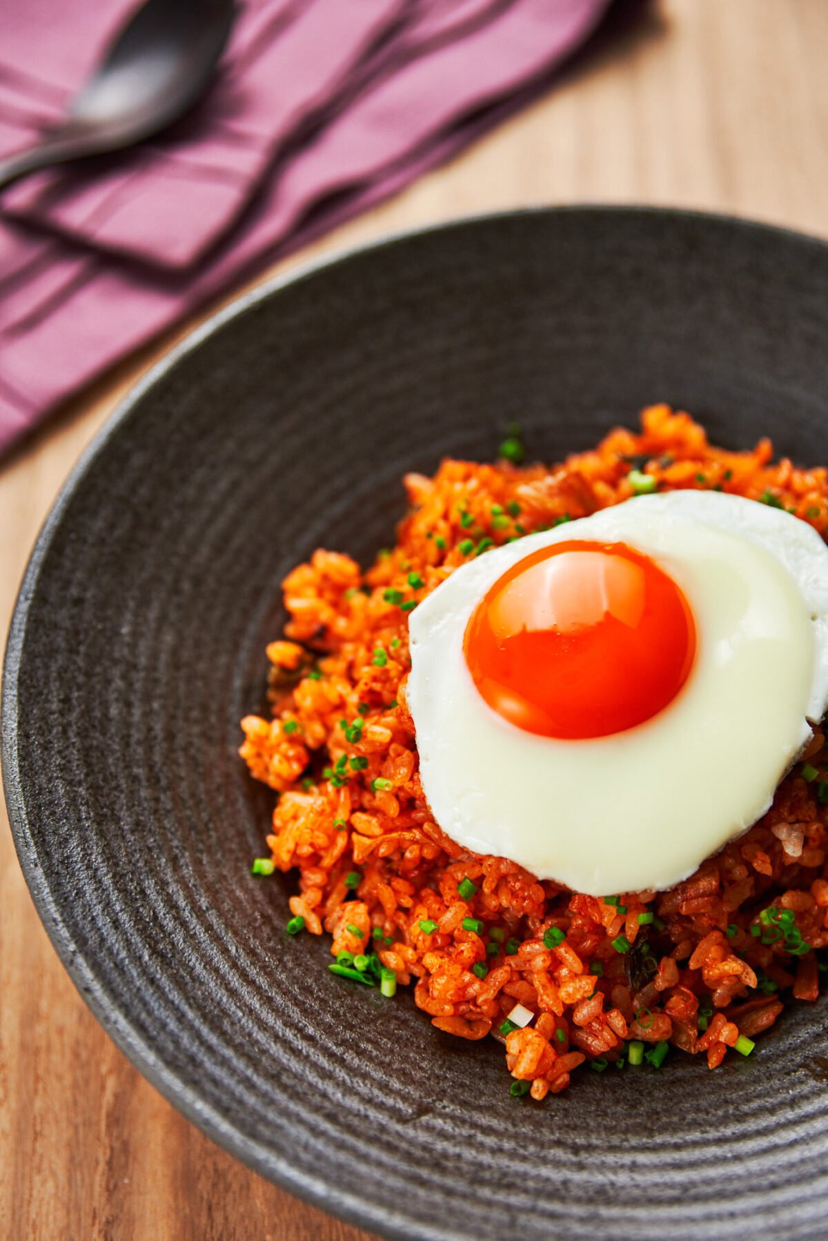 Spicy and loaded wtih flavor, this easy kimchi fried rice with a fried egg on top comes together from just a handful of ingredients.