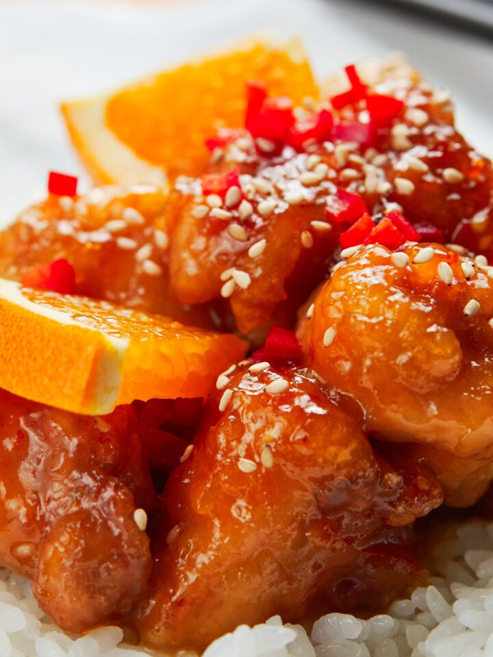 Crisp juicy fried chicken glazed in a sweet and sour orange sauce that's redolent of fresh citrus thanks to a triple dose of orange.