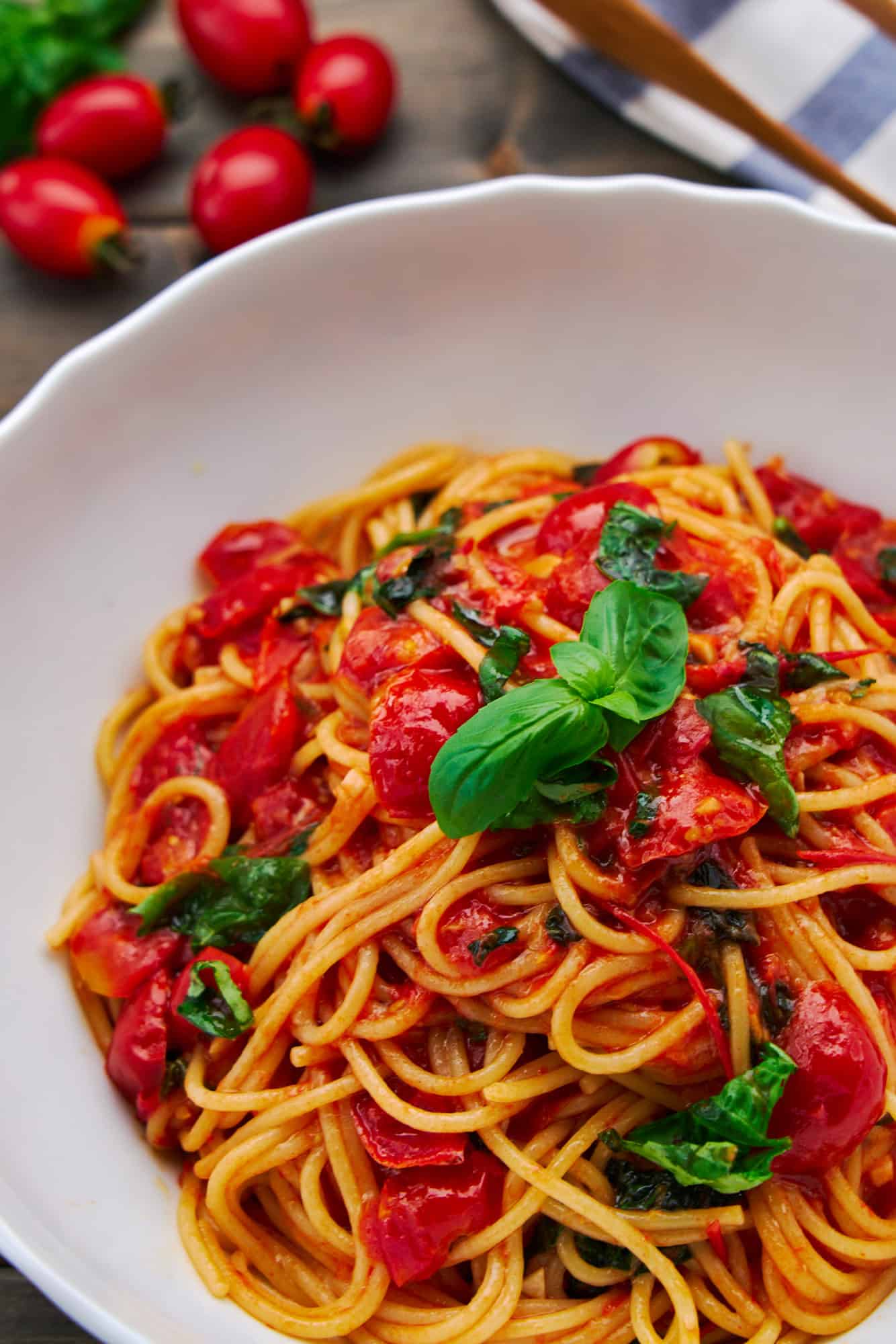 Al dente spaghetti paired with vibrant pomodoro sauce made with sun ripened tomatoes and fresh basil. It's a classic Italian summer pasta.
