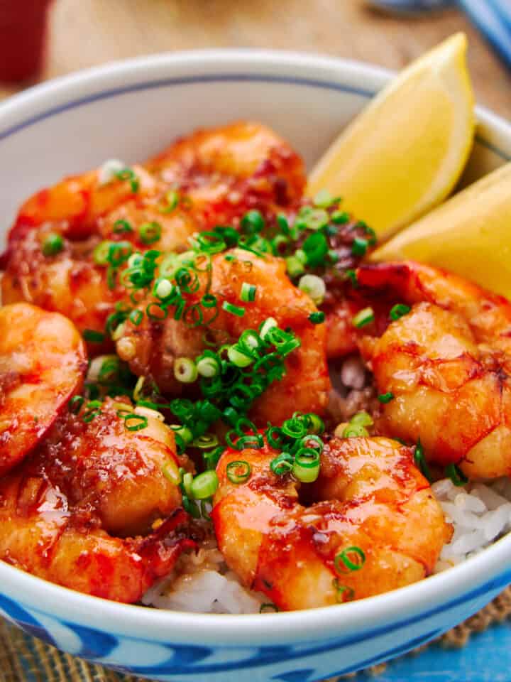 Easy shrimp rice bowl with plump juicy shrimp glazed with a decadent garlic butter-soy sauce on a bed of rice.
