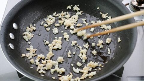 Stir-frying garlic.