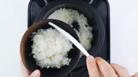 Serving rice in a rice bowl.