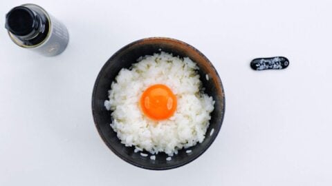 Tamagokake gohan with a raw egg yolk on top.