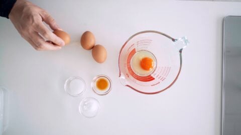 Break the eggs into a bowl with a spout.